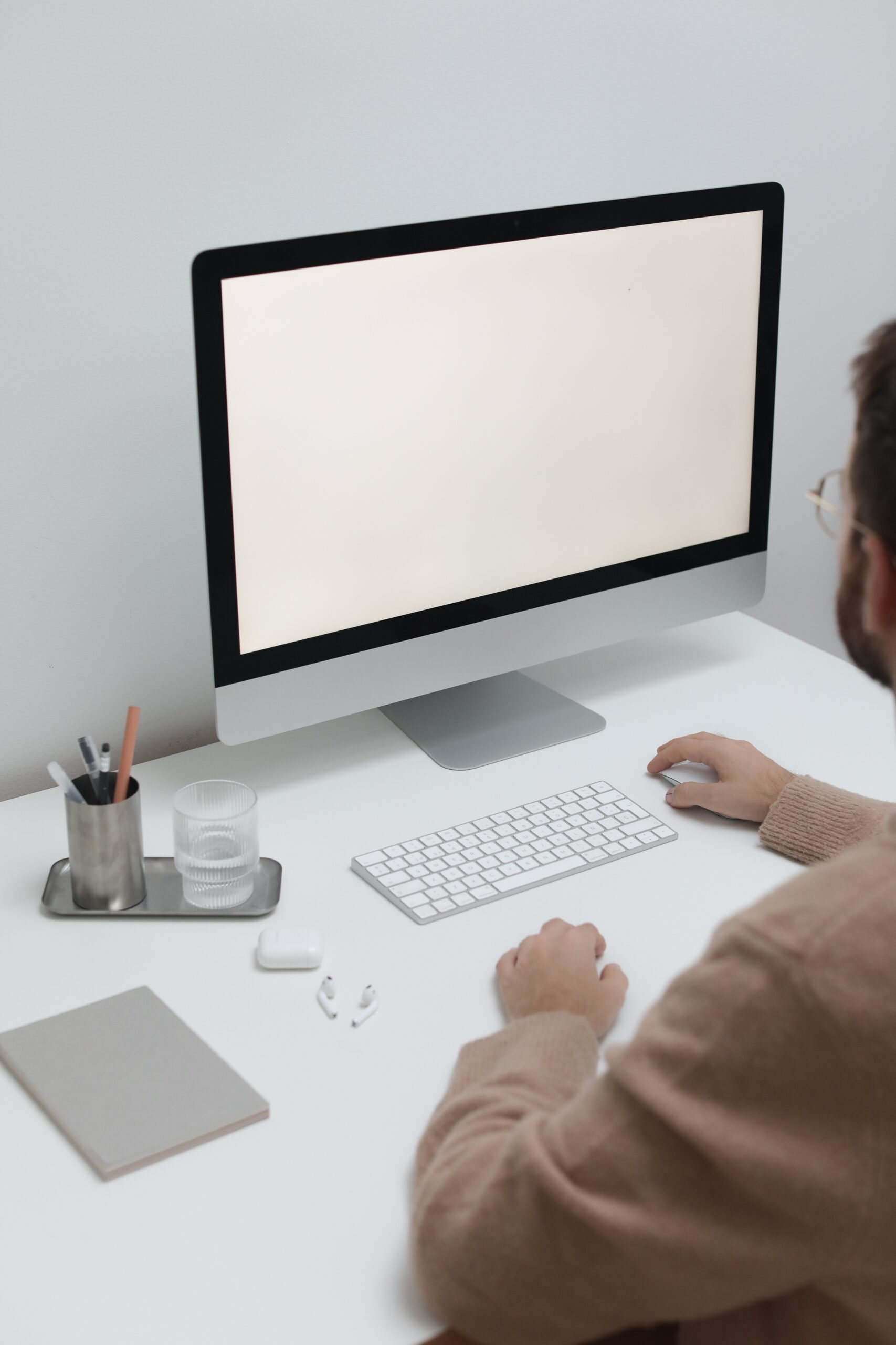 Free Crop man working on computer in workplace Stock Photo